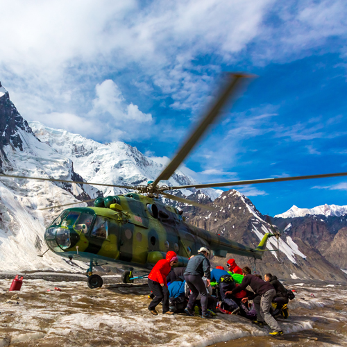 rescue helicopter on snowy mountain